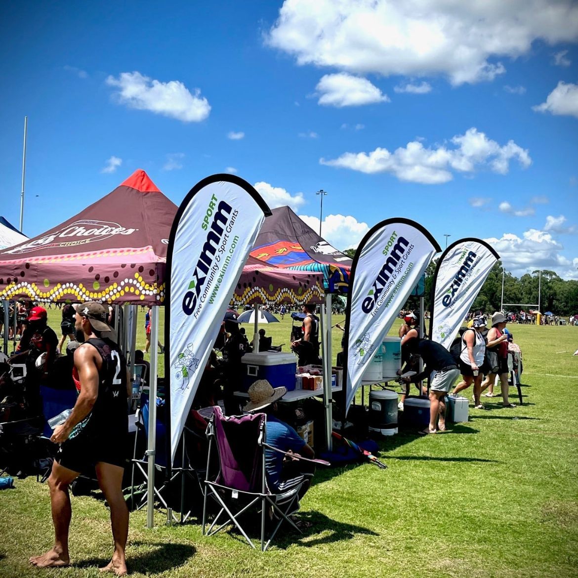 Eximm Sport Banners on the football field as sponsors for the Indigenous touch football team.