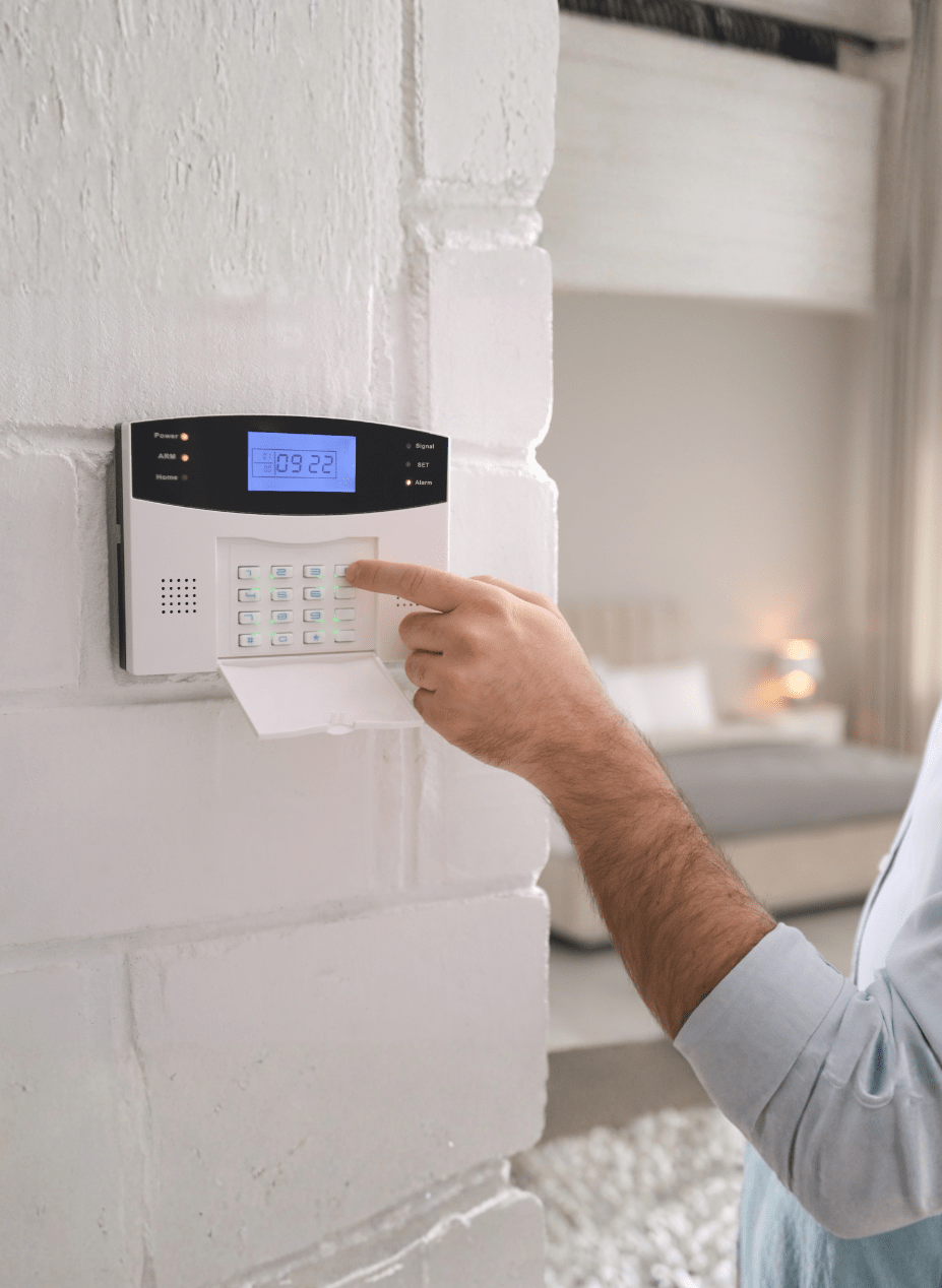 Security Monitoring operators reviewing multiple screens of security camera footage in a security monitoring Centre.