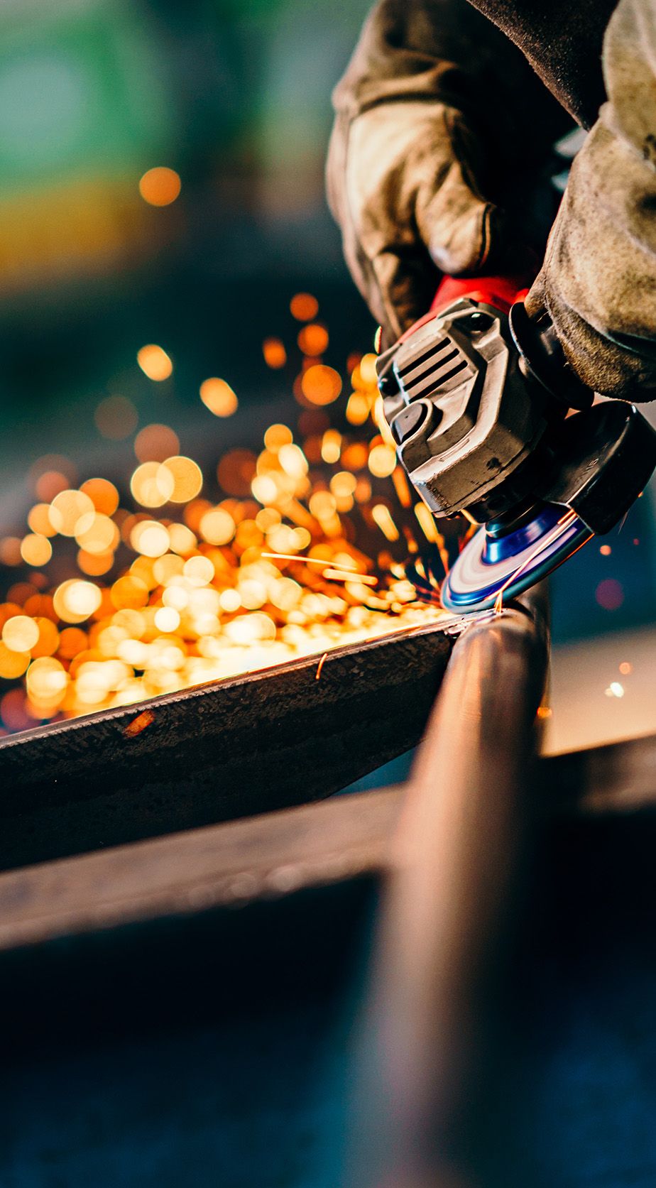 A metal fabricator grinding metal.