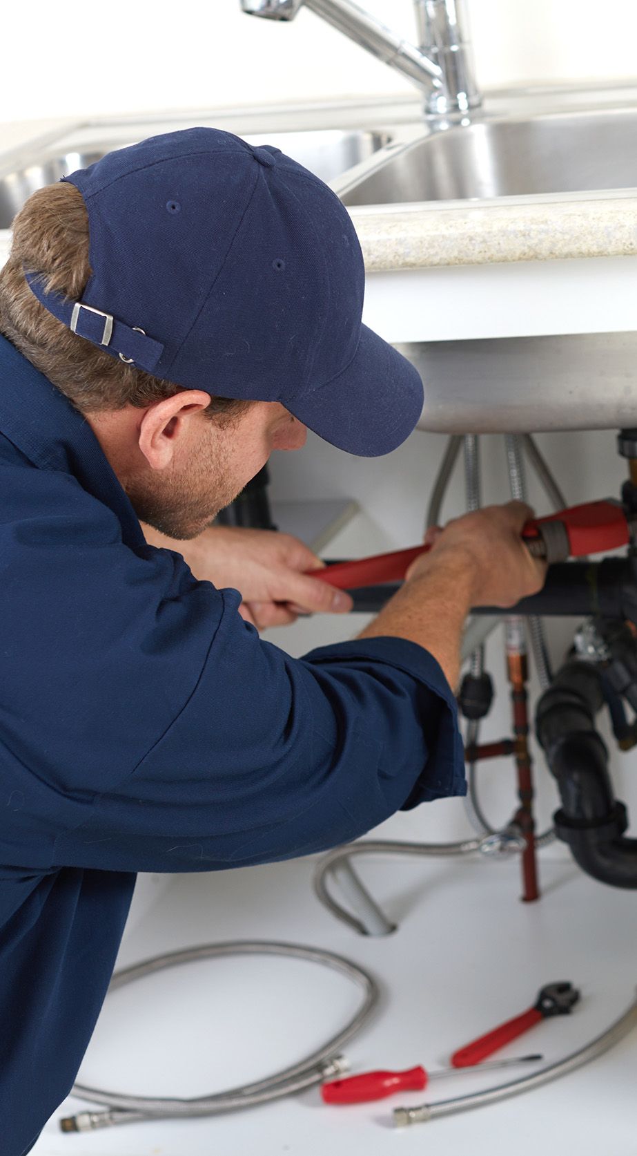 Property Maintenance Plumbing under kitchen sink.